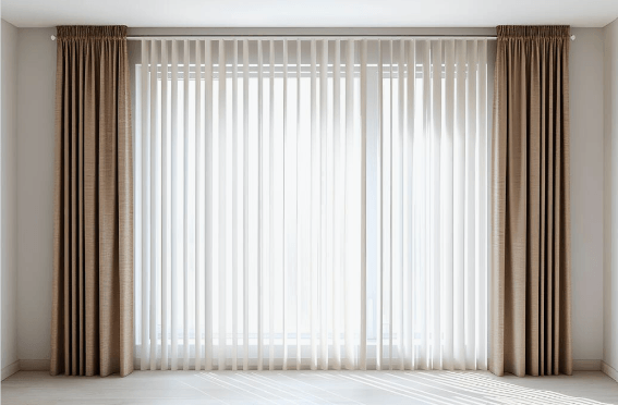 Sheer vertical blinds framed by linen drapery panels